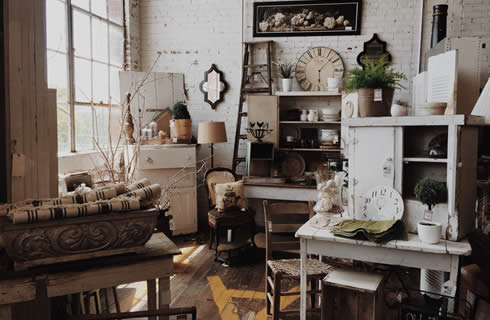 An antique store full of shabby chic furniture and goods.